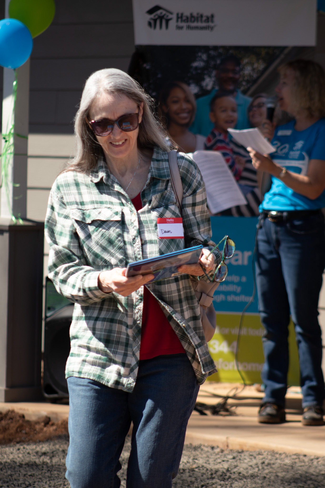 A smiling woman at the celebration